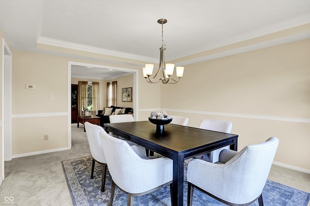 10746 Gateway Dr, Fishers, IN 46037 - dining room featuring light carpet, a chandelier, baseboards, and ornamental molding