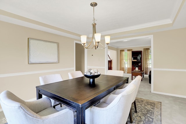10746 Gateway Dr, Fishers, IN 46037 - dining space with a chandelier, light carpet, and a raised ceiling