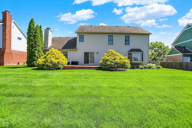 10746 Gateway Dr, Fishers, IN 46037 - back of house featuring a deck, a chimney, and central AC unit