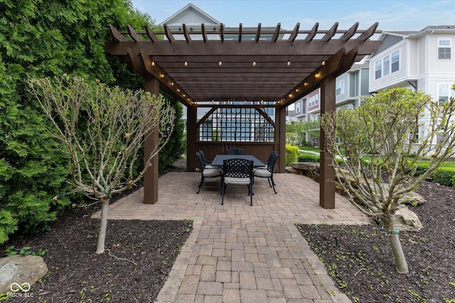 view of patio / terrace featuring a pergola and outdoor dining area