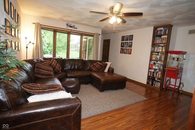 314 Olive St, Batesville, IN 47006 - living area featuring baseboards, ceiling fan, visible vents, and wood finished floors