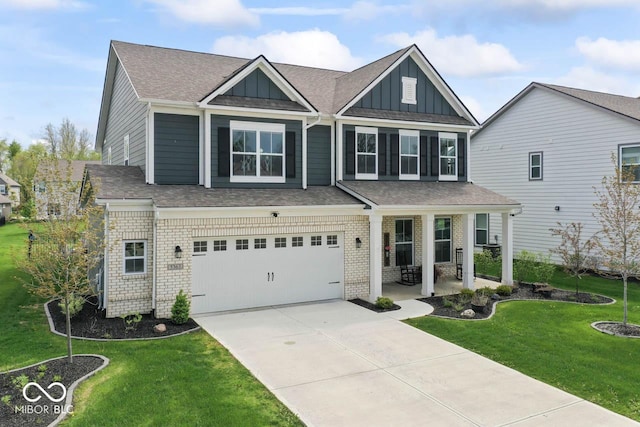 5363 Citadel Dr, Noblesville, IN 46062 - view of front of property featuring board and batten siding, a front lawn, concrete driveway, and a garage