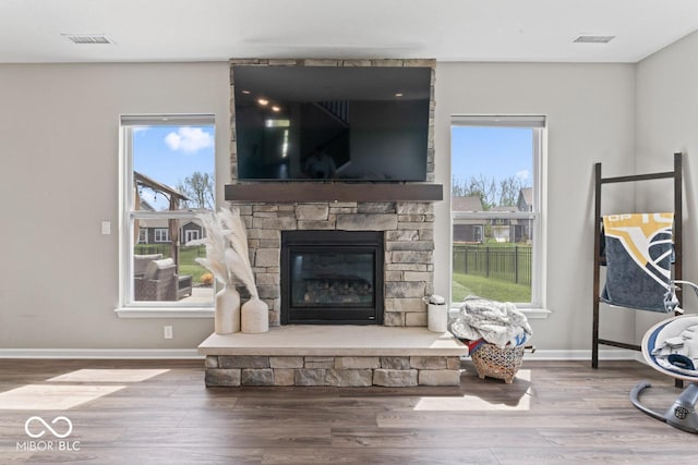 5363 Citadel Dr, Noblesville, IN 46062 - living room with healthy amount of natural light, wood finished floors, and baseboards