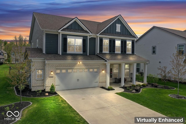 5363 Citadel Dr, Noblesville, IN 46062 - view of front of house with board and batten siding, a front yard, driveway, and a garage