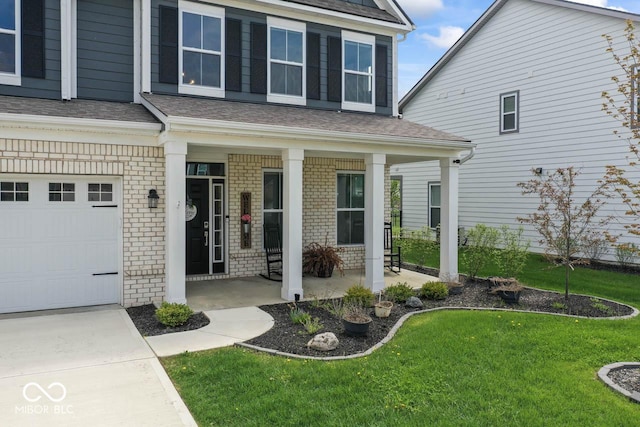 5363 Citadel Dr, Noblesville, IN 46062 - doorway to property with brick siding, covered porch, a lawn, and a shingled roof