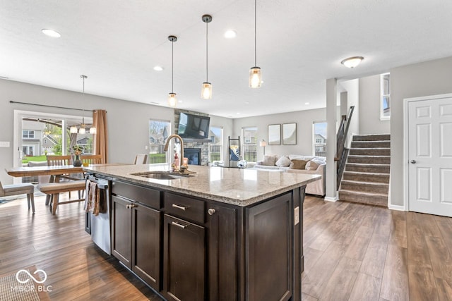 5363 Citadel Dr, Noblesville, IN 46062 - kitchen featuring a sink, dark brown cabinetry, a fireplace, dark wood-style flooring, and recessed lighting