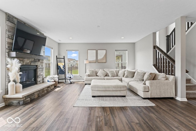5363 Citadel Dr, Noblesville, IN 46062 - living area with baseboards, a stone fireplace, wood finished floors, stairs, and recessed lighting