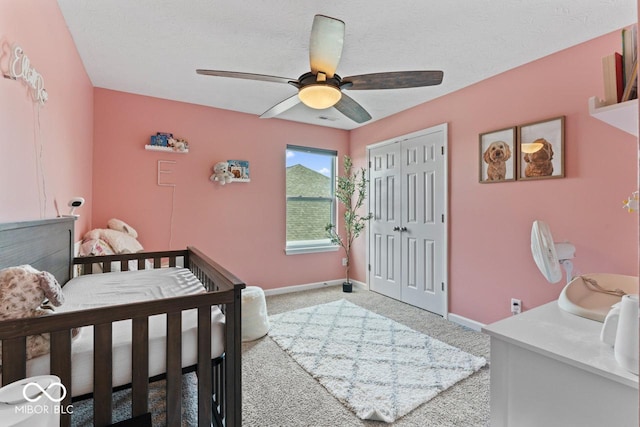 5363 Citadel Dr, Noblesville, IN 46062 - bedroom featuring light carpet, a closet, baseboards, a ceiling fan, and a textured ceiling