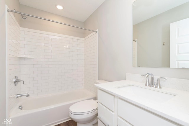 full bath featuring toilet, bathtub / shower combination, and vanity