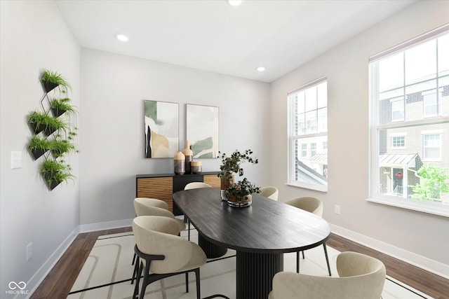 dining area featuring baseboards, recessed lighting, and dark wood-type flooring