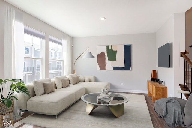 living room featuring recessed lighting, baseboards, and wood finished floors