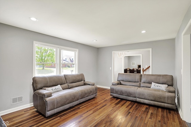 living area featuring visible vents, recessed lighting, dark wood finished floors, and baseboards