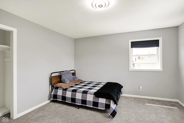 carpeted bedroom with baseboards