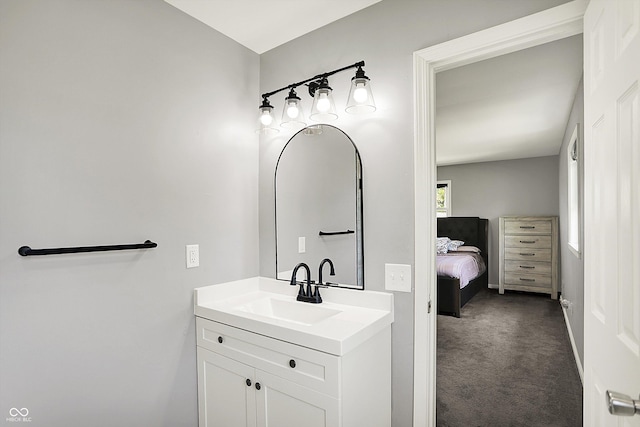 bathroom with vanity and baseboards