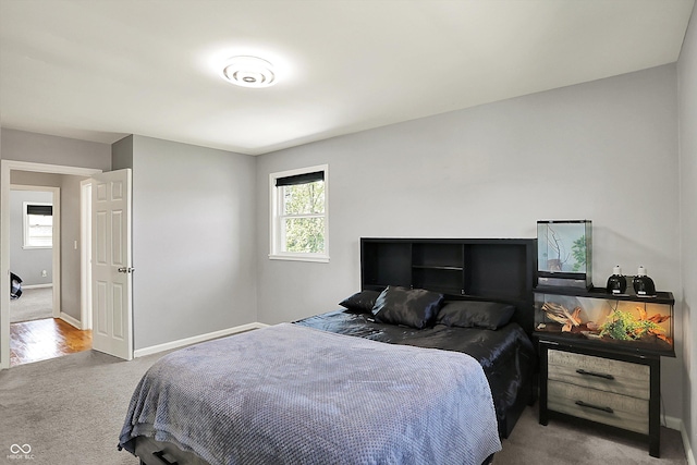 carpeted bedroom with baseboards