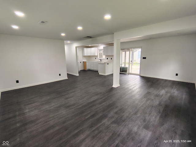 804 S Albany St, Selma, IN 47383 - unfurnished living room with visible vents, recessed lighting, dark wood-style flooring, and baseboards