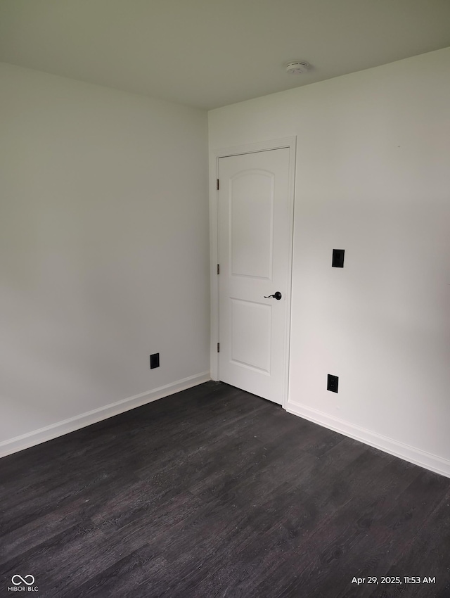 804 S Albany St, Selma, IN 47383 - unfurnished room with baseboards and dark wood finished floors