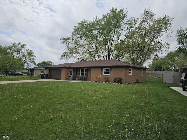 ranch-style home featuring brick siding, driveway, a front lawn, and a garage