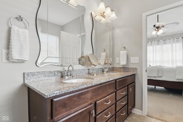 full bath featuring plenty of natural light, a sink, and ceiling fan