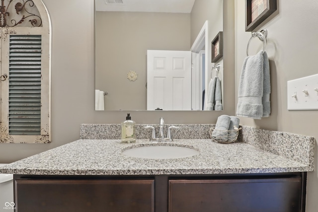 bathroom featuring vanity and visible vents