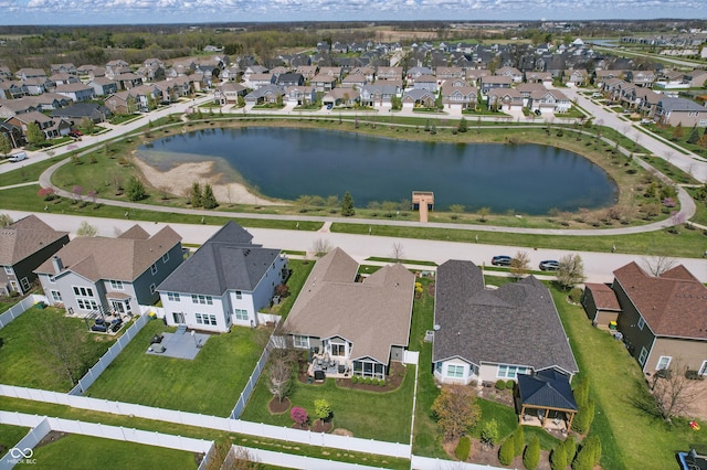 bird's eye view featuring a water view and a residential view