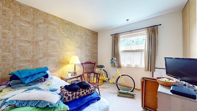 carpeted bedroom featuring baseboards