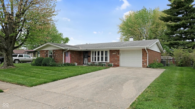 ranch-style home featuring brick siding, an attached garage, and a front yard