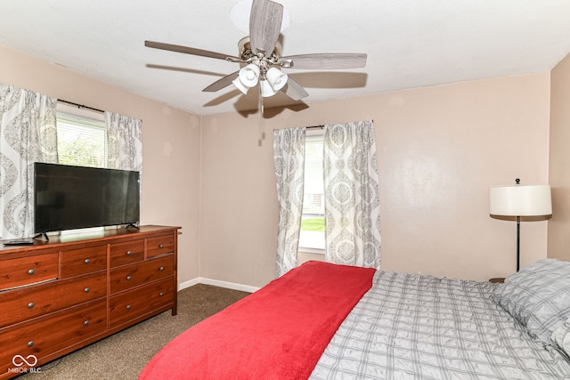 bedroom featuring carpet floors, a ceiling fan, and baseboards
