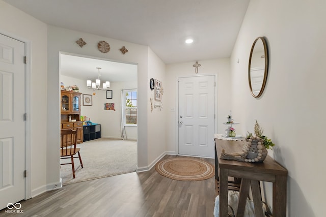 5845 Cresswell Ln, Whitestown, IN 46075 - entryway with wood finished floors, a chandelier, baseboards, and recessed lighting