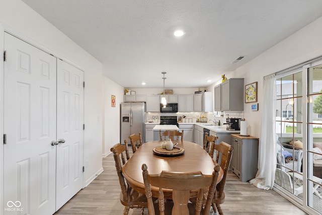 5845 Cresswell Ln, Whitestown, IN 46075 - dining area featuring light wood-style floors, recessed lighting, and baseboards