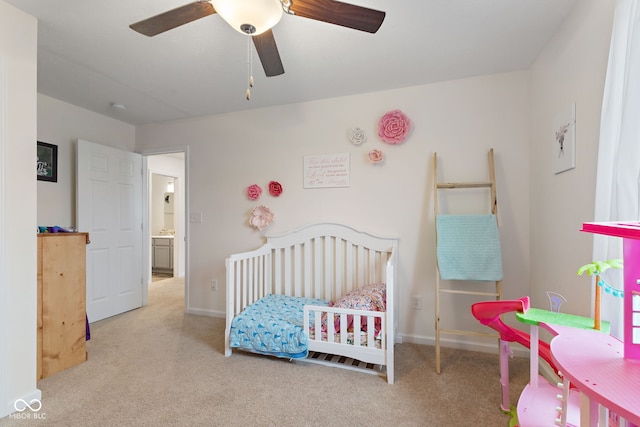 5845 Cresswell Ln, Whitestown, IN 46075 - bedroom featuring carpet floors, baseboards, a nursery area, and ceiling fan