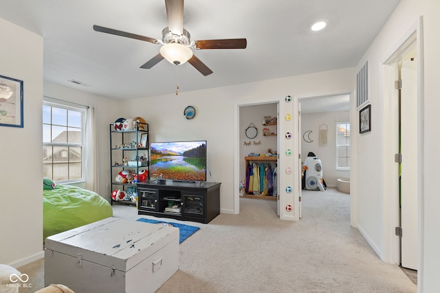 5845 Cresswell Ln, Whitestown, IN 46075 - carpeted living room with a ceiling fan and baseboards