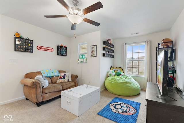 5845 Cresswell Ln, Whitestown, IN 46075 - living area featuring a ceiling fan, carpet flooring, and baseboards