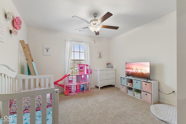 5845 Cresswell Ln, Whitestown, IN 46075 - carpeted bedroom featuring a ceiling fan, baseboards, and a crib