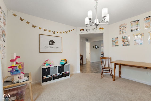 5845 Cresswell Ln, Whitestown, IN 46075 - recreation room featuring carpet floors, a chandelier, and baseboards