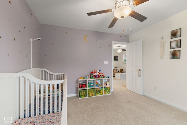 5845 Cresswell Ln, Whitestown, IN 46075 - bedroom with carpet floors, ceiling fan, baseboards, and a crib