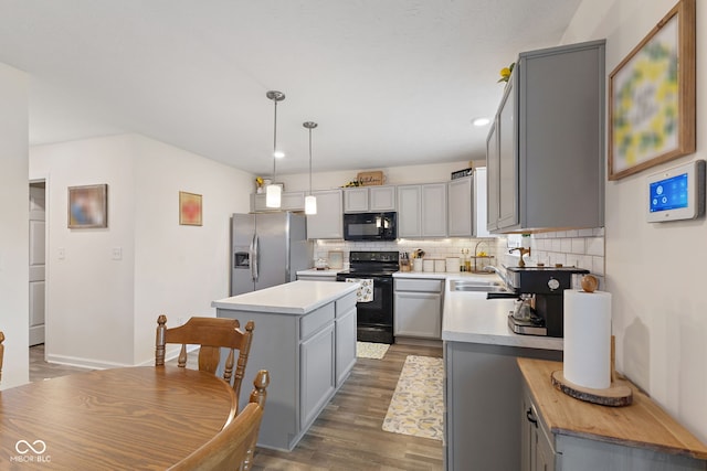 5845 Cresswell Ln, Whitestown, IN 46075 - kitchen featuring black appliances, gray cabinets, backsplash, a center island, and recessed lighting