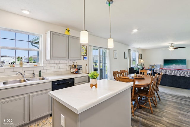 5845 Cresswell Ln, Whitestown, IN 46075 - kitchen featuring gray cabinetry, wood finished floors, open floor plan, black dishwasher, and a ceiling fan