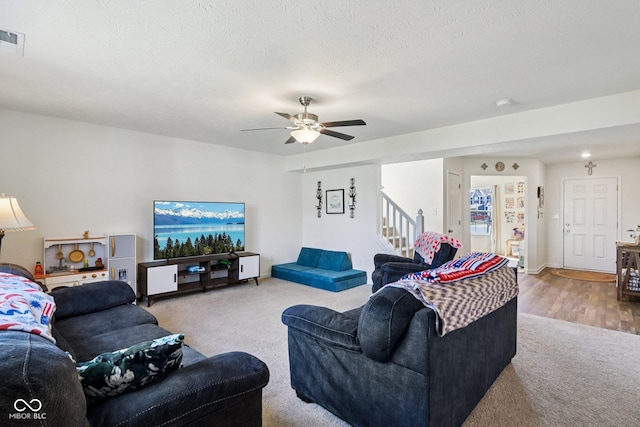 5845 Cresswell Ln, Whitestown, IN 46075 - carpeted living room with stairway and a ceiling fan