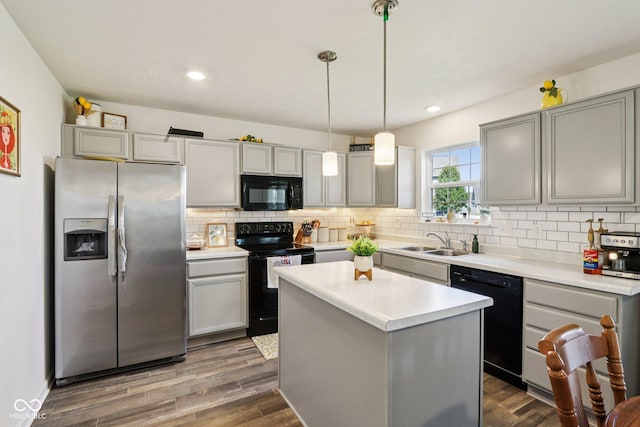5845 Cresswell Ln, Whitestown, IN 46075 - kitchen featuring black appliances, gray cabinetry, tasteful backsplash, dark wood-style flooring, and recessed lighting
