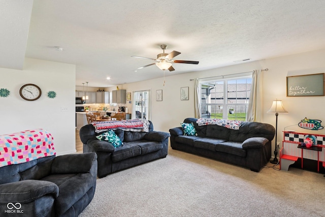 5845 Cresswell Ln, Whitestown, IN 46075 - living area featuring light colored carpet and ceiling fan