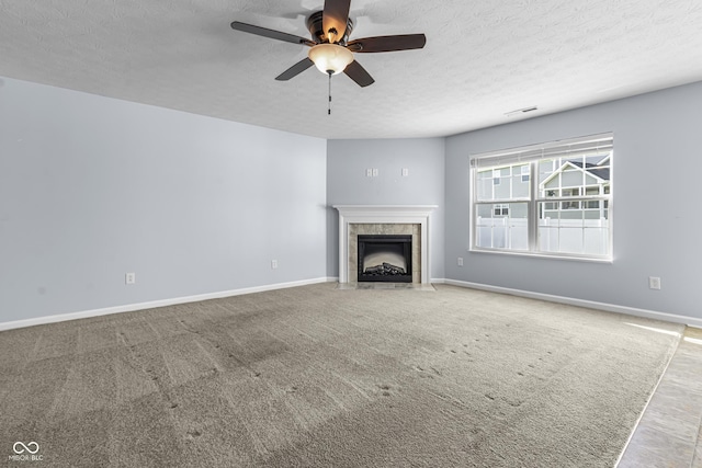 5465 Tanglewood Ln, Whitestown, IN 46075 - unfurnished living room featuring baseboards, a textured ceiling, ceiling fan, and a premium fireplace