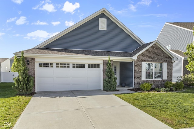 5465 Tanglewood Ln, Whitestown, IN 46075 - view of front of house featuring concrete driveway, brick siding, an attached garage, and a front yard