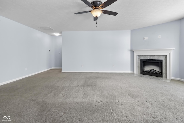 5465 Tanglewood Ln, Whitestown, IN 46075 - unfurnished living room featuring visible vents, baseboards, ceiling fan, a tiled fireplace, and carpet