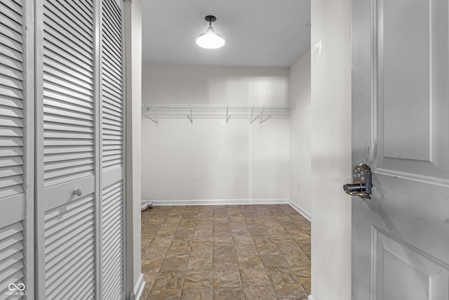 5465 Tanglewood Ln, Whitestown, IN 46075 - spacious closet with stone finish floor