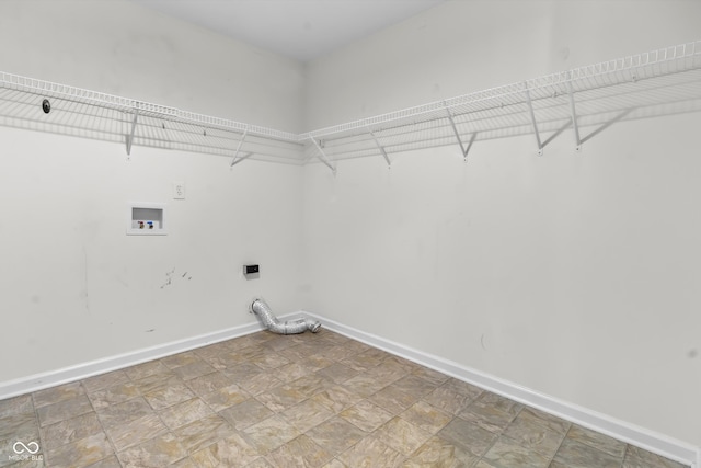 5465 Tanglewood Ln, Whitestown, IN 46075 - laundry area featuring laundry area, washer hookup, stone finish floor, baseboards, and hookup for an electric dryer