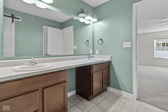 5465 Tanglewood Ln, Whitestown, IN 46075 - full bath featuring double vanity, baseboards, a sink, and tile patterned flooring