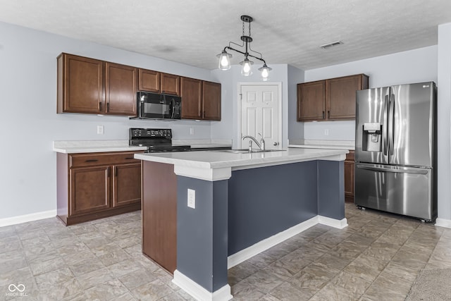 5465 Tanglewood Ln, Whitestown, IN 46075 - kitchen featuring hanging light fixtures, light countertops, baseboards, a sink, and black appliances