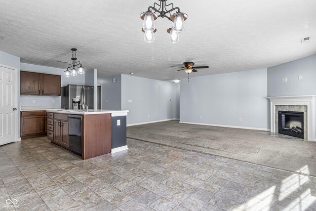 5465 Tanglewood Ln, Whitestown, IN 46075 - kitchen with light countertops, stainless steel fridge with ice dispenser, baseboards, open floor plan, and black dishwasher