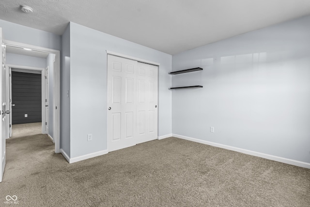 5465 Tanglewood Ln, Whitestown, IN 46075 - unfurnished bedroom with carpet floors, baseboards, and a closet